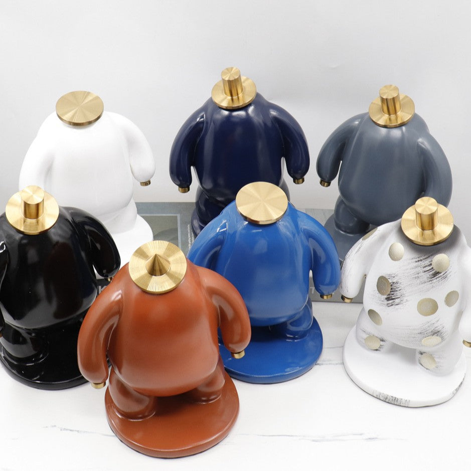 Abstract Faceless Fat Figure Statue with Gold Metal Hat