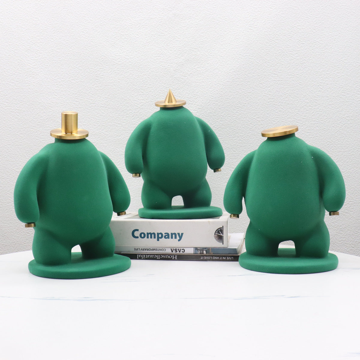 Abstract Faceless Fat Figure Statue with Gold Metal Hat